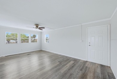 Welcome to this charming double-wide manufactured home located on Lemon Bay Golf Club in Florida - for sale on GolfHomes.com, golf home, golf lot