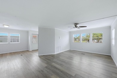 Welcome to this charming double-wide manufactured home located on Lemon Bay Golf Club in Florida - for sale on GolfHomes.com, golf home, golf lot