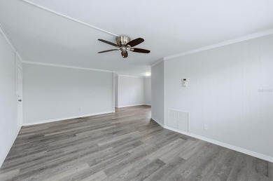 Welcome to this charming double-wide manufactured home located on Lemon Bay Golf Club in Florida - for sale on GolfHomes.com, golf home, golf lot