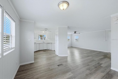 Welcome to this charming double-wide manufactured home located on Lemon Bay Golf Club in Florida - for sale on GolfHomes.com, golf home, golf lot