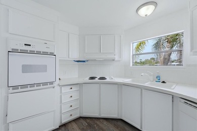 Welcome to this charming double-wide manufactured home located on Lemon Bay Golf Club in Florida - for sale on GolfHomes.com, golf home, golf lot