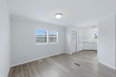 Welcome to this charming double-wide manufactured home located on Lemon Bay Golf Club in Florida - for sale on GolfHomes.com, golf home, golf lot