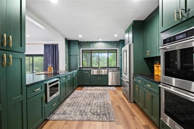 Architectural Gem in Sought-After Phase 1 of Carrollwood Village on Emerald Greens Golf Resort and Country Club in Florida - for sale on GolfHomes.com, golf home, golf lot