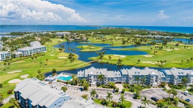 Expansive views of the resort's golf course  ponds. This on Ocean Club At the Hutchinson Island Beach Resort and Marina in Florida - for sale on GolfHomes.com, golf home, golf lot