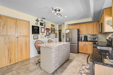 Start the new year in this beautifully maintained 2BR/2BA plus on Peridia Golf and Country Club in Florida - for sale on GolfHomes.com, golf home, golf lot