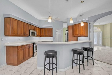 Gracefully positioned on a private homesite within the on Calusa Lakes Golf Club in Florida - for sale on GolfHomes.com, golf home, golf lot