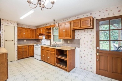 This private and secluded two story home sits on a huge, treed on Loch Lloyd Country Club in Missouri - for sale on GolfHomes.com, golf home, golf lot