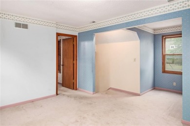 This private and secluded two story home sits on a huge, treed on Loch Lloyd Country Club in Missouri - for sale on GolfHomes.com, golf home, golf lot
