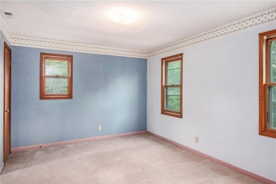 This private and secluded two story home sits on a huge, treed on Loch Lloyd Country Club in Missouri - for sale on GolfHomes.com, golf home, golf lot