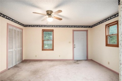 This private and secluded two story home sits on a huge, treed on Loch Lloyd Country Club in Missouri - for sale on GolfHomes.com, golf home, golf lot