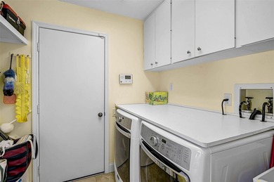 Start the new year in this beautifully maintained 2BR/2BA plus on Peridia Golf and Country Club in Florida - for sale on GolfHomes.com, golf home, golf lot