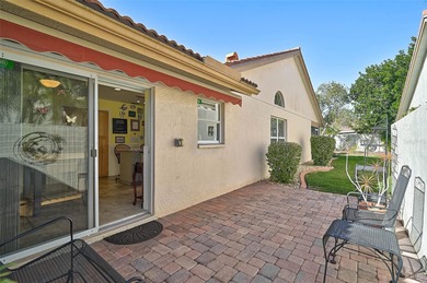 Start the new year in this beautifully maintained 2BR/2BA plus on Peridia Golf and Country Club in Florida - for sale on GolfHomes.com, golf home, golf lot