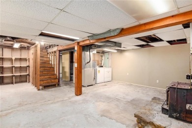 This private and secluded two story home sits on a huge, treed on Loch Lloyd Country Club in Missouri - for sale on GolfHomes.com, golf home, golf lot