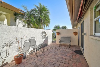 Start the new year in this beautifully maintained 2BR/2BA plus on Peridia Golf and Country Club in Florida - for sale on GolfHomes.com, golf home, golf lot