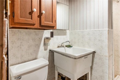 This private and secluded two story home sits on a huge, treed on Loch Lloyd Country Club in Missouri - for sale on GolfHomes.com, golf home, golf lot