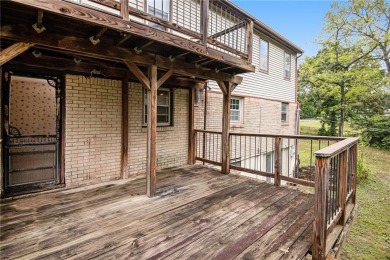 This private and secluded two story home sits on a huge, treed on Loch Lloyd Country Club in Missouri - for sale on GolfHomes.com, golf home, golf lot