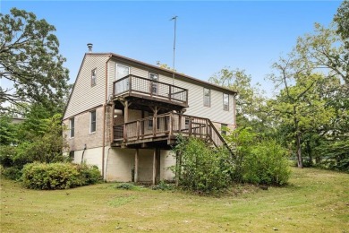 This private and secluded two story home sits on a huge, treed on Loch Lloyd Country Club in Missouri - for sale on GolfHomes.com, golf home, golf lot