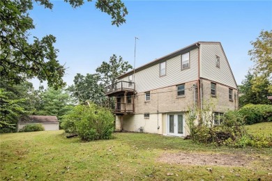 This private and secluded two story home sits on a huge, treed on Loch Lloyd Country Club in Missouri - for sale on GolfHomes.com, golf home, golf lot