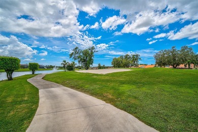 Start the new year in this beautifully maintained 2BR/2BA plus on Peridia Golf and Country Club in Florida - for sale on GolfHomes.com, golf home, golf lot