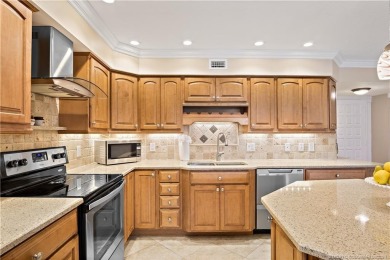 Enjoy courtyard views from this renovated, 2cd floor condo in on Martin County Golf Course in Florida - for sale on GolfHomes.com, golf home, golf lot