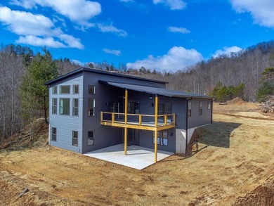 Modern sophistication meets mountain serenity on this newly on Mill Creek Country Club in North Carolina - for sale on GolfHomes.com, golf home, golf lot