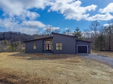 Modern sophistication meets mountain serenity on this newly on Mill Creek Country Club in North Carolina - for sale on GolfHomes.com, golf home, golf lot