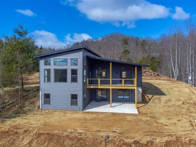Modern sophistication meets mountain serenity on this newly on Mill Creek Country Club in North Carolina - for sale on GolfHomes.com, golf home, golf lot