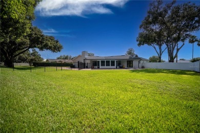 This stunningly remodeled 4/3 pool home in the highly on Lone Palm Golf Club in Florida - for sale on GolfHomes.com, golf home, golf lot