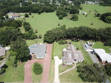 This stunningly remodeled 4/3 pool home in the highly on Lone Palm Golf Club in Florida - for sale on GolfHomes.com, golf home, golf lot