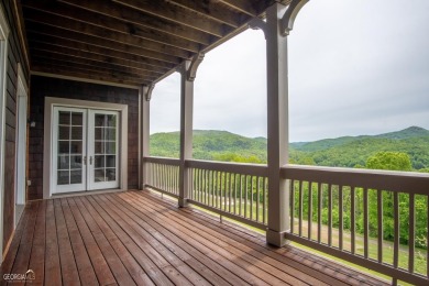 Perched above Lake Burton overlooking stunning views of the lake on Waterfall Country Club in Georgia - for sale on GolfHomes.com, golf home, golf lot