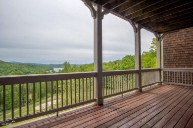 Perched above Lake Burton overlooking stunning views of the lake on Waterfall Country Club in Georgia - for sale on GolfHomes.com, golf home, golf lot