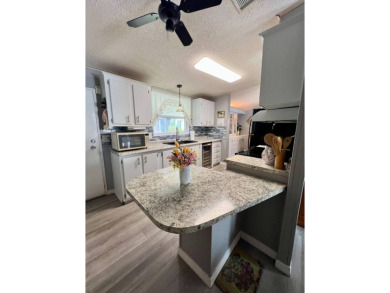 Charming, Fully Furnished Home - Move-In Ready! Step into on Lake Henry Golf Club in Florida - for sale on GolfHomes.com, golf home, golf lot