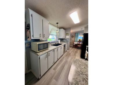 Charming, Fully Furnished Home - Move-In Ready! Step into on Lake Henry Golf Club in Florida - for sale on GolfHomes.com, golf home, golf lot