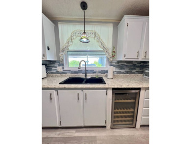 Charming, Fully Furnished Home - Move-In Ready! Step into on Lake Henry Golf Club in Florida - for sale on GolfHomes.com, golf home, golf lot