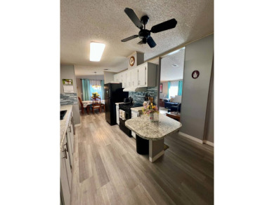 Charming, Fully Furnished Home - Move-In Ready! Step into on Lake Henry Golf Club in Florida - for sale on GolfHomes.com, golf home, golf lot