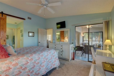 Well maintained END UNIT with WATER VIEW, spacious HIGH CEILINGS on The Meadows Golf and Country Club in Florida - for sale on GolfHomes.com, golf home, golf lot