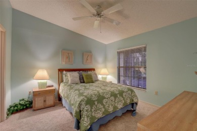 Well maintained END UNIT with WATER VIEW, spacious HIGH CEILINGS on The Meadows Golf and Country Club in Florida - for sale on GolfHomes.com, golf home, golf lot