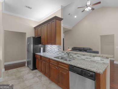 This gorgeous 3 bedroom/2.5 bathroom brick home is located on on Canongate At Georgia National Golf Club in Georgia - for sale on GolfHomes.com, golf home, golf lot