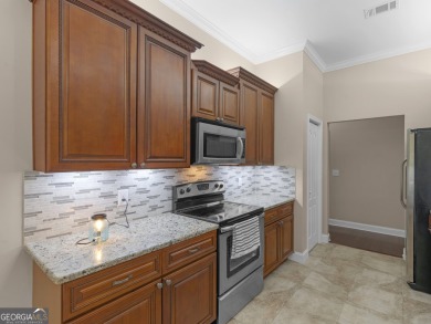 This gorgeous 3 bedroom/2.5 bathroom brick home is located on on Canongate At Georgia National Golf Club in Georgia - for sale on GolfHomes.com, golf home, golf lot