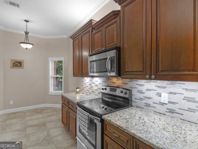 This gorgeous 3 bedroom/2.5 bathroom brick home is located on on Canongate At Georgia National Golf Club in Georgia - for sale on GolfHomes.com, golf home, golf lot