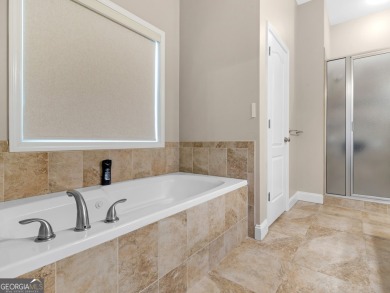 This gorgeous 3 bedroom/2.5 bathroom brick home is located on on Canongate At Georgia National Golf Club in Georgia - for sale on GolfHomes.com, golf home, golf lot