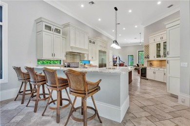 Discover unparalleled luxury at 6489 Highcroft Drive, an on Quail West Golf and Country Club in Florida - for sale on GolfHomes.com, golf home, golf lot