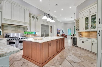 Discover unparalleled luxury at 6489 Highcroft Drive, an on Quail West Golf and Country Club in Florida - for sale on GolfHomes.com, golf home, golf lot