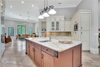 Discover unparalleled luxury at 6489 Highcroft Drive, an on Quail West Golf and Country Club in Florida - for sale on GolfHomes.com, golf home, golf lot