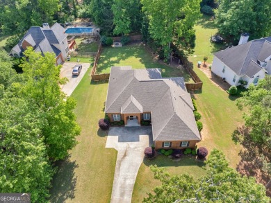 This gorgeous 3 bedroom/2.5 bathroom brick home is located on on Canongate At Georgia National Golf Club in Georgia - for sale on GolfHomes.com, golf home, golf lot