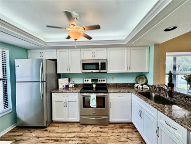 MOTIVATED SELLER! Bring Offers. FULLY FURNISHED END UNIT where on The Meadows Golf and Country Club in Florida - for sale on GolfHomes.com, golf home, golf lot