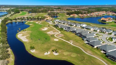 Situated on a corner lot, this contemporary two-story home with on Venetian Bay Golf Course in Florida - for sale on GolfHomes.com, golf home, golf lot