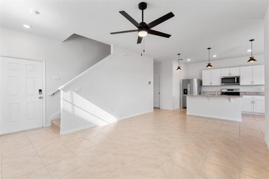 Situated on a corner lot, this contemporary two-story home with on Venetian Bay Golf Course in Florida - for sale on GolfHomes.com, golf home, golf lot