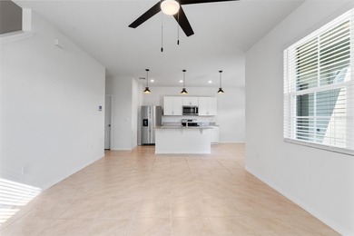 Situated on a corner lot, this contemporary two-story home with on Venetian Bay Golf Course in Florida - for sale on GolfHomes.com, golf home, golf lot