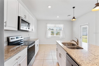 Situated on a corner lot, this contemporary two-story home with on Venetian Bay Golf Course in Florida - for sale on GolfHomes.com, golf home, golf lot